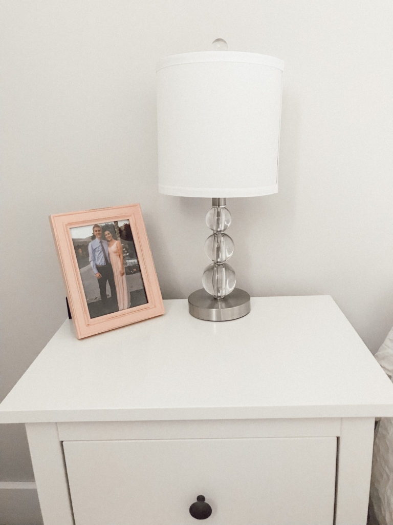 Nightstand with photo frame and lamp